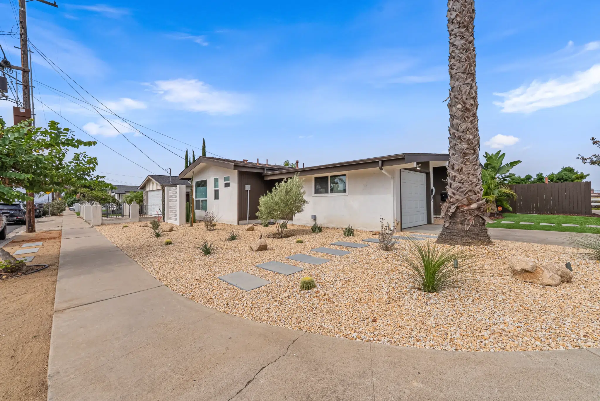 Front exterior of the remodeled Adler Avenue home with drought-tolerant landscaping, San Diego