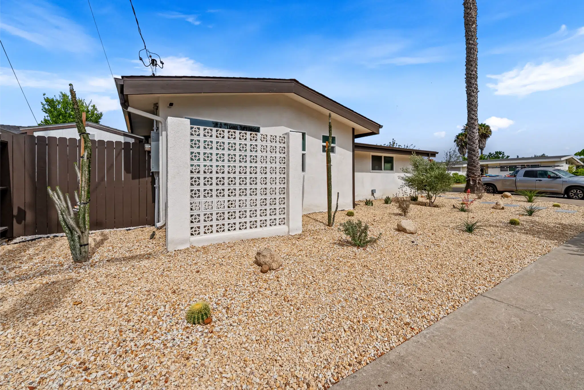 Updated home exterior and garage with desert landscaping, San Diego addition